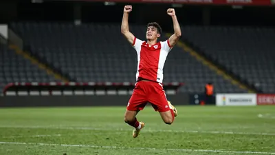 PSV Eindhoven secured a key victory at FC Utrecht, with defender Mauro Junior celebrating a goal with midfielder Kodai...